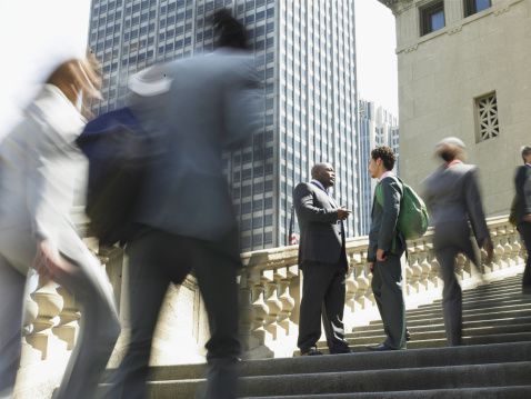 Two businessmen meeting on steps
