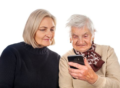 Elderly woman texting on the phone