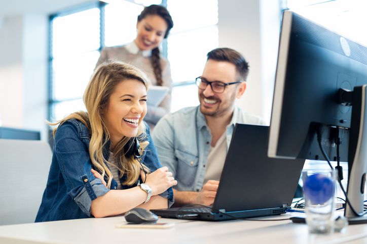 Group of business people and software developers working as a team in office Group of business people and software developers working as a team in office